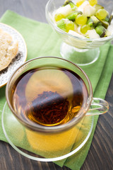 Hot tea and ice cream with fruits