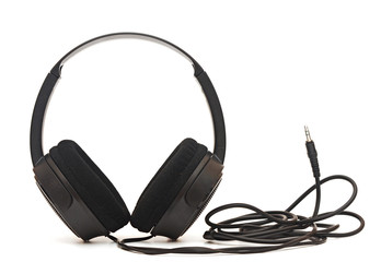 black pair of headphones isolated on a white background