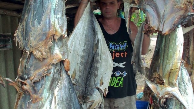 Shopper in the trade stand with stockfish  at a road.