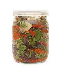Vegetable in glass jar on a white background
