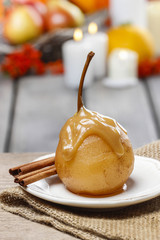 Pear with caramel sauce. French dessert