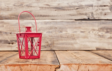 red vintage lamp on wooden table