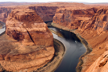 Two Boats Navigate Colorado River Deep Canyon Horseshoe Bend