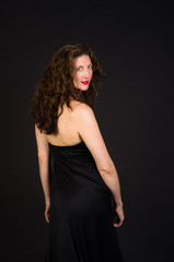 Naklejka premium Attractive middle aged woman in black dress