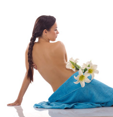  beautiful woman with blue spa towels on white