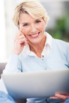 attractive middle aged woman with laptop computer