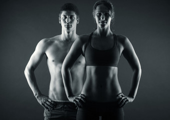 Fototapeta na wymiar Man and woman's torso isolated on a black background