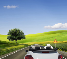 Travelling in a white convertible