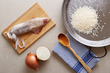 Preparing squid rice paella ingredients