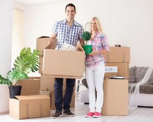 Cheerful couple their new home