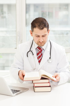 Male doctor is studying