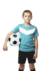 A boy holding a soccer ball