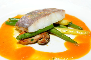 Fine dining, John Dory fish fillet on asparagus