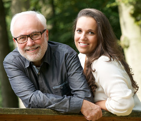Fototapeta premium Mature father and young daughter smiling outdoors