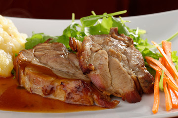 Fried pork chop, mashed potato and vegetable salad