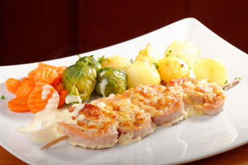 Shish kebab with pork, potatoes, vegetables