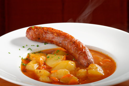 Wurst goulash soup with meat sausage and potatoes