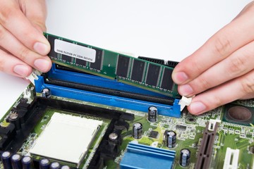 Man installing memory. PC motherboard RAM upgrade