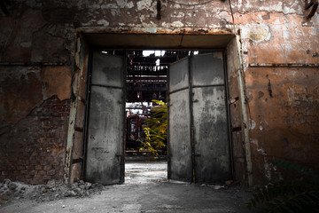 Fototapeta na wymiar iron gate in an industrial building