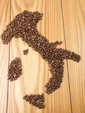 Italy map with Coffee beans on the wood table