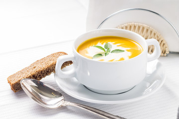 Pumpkin soup on served table