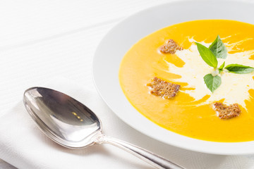 Pumpkin soup on served table