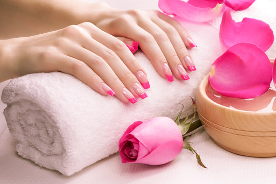 pink manicure with towel. Spa