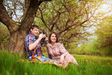 Fototapeta premium Happy loving couple on a spring meadow