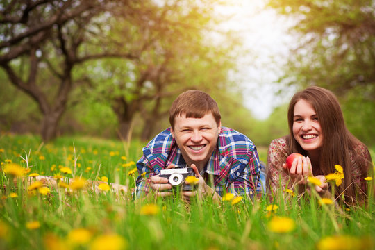 Happy loving couple on a spring meadow