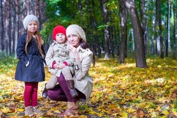 Young mother with her wonderful beautiful daughter walk in