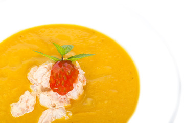 Pumpkin soup with shrimp and tomato