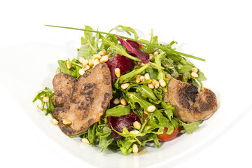 rabbit liver salad with arugula in a restaurant
