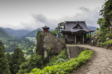 Fototapeta premium view of japanese buddhist temple in Yamadera with beautiful land