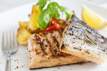 Grilled salmon filet with baked potatoes