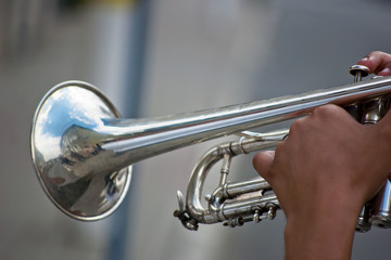 Fototapeta na wymiar man playing the silver trumpet
