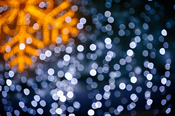Blurred snowflake and lights background
