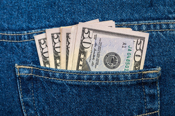 US dollar bills in the back jeans pocket