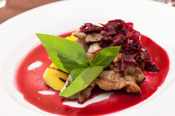 meat with mango and cherry sauce