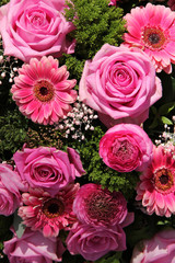 Ranunculus, roses and gerberas in a wedding arrangement