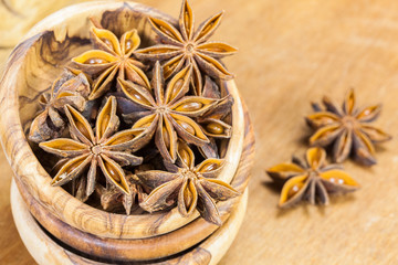 Star anise in olive wood bowl