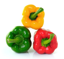 red green yellow pepper on white background