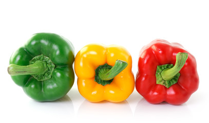 green yellow red pepper on white background