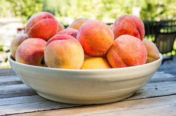 Bowl of fresh yellow peaches