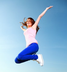 Attractive girl Young woman jumping sky