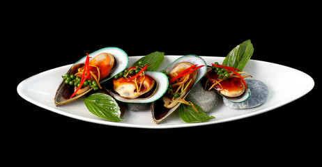 New Zealand green mussels on black background