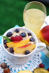 Oatmeal in cup with berries