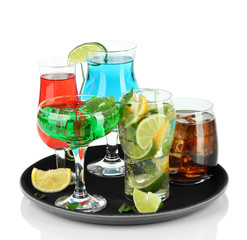 Many glasses of cocktails on tray, isolated on white