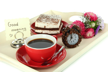 Cup of tea with cakes on wooden tray isolated on white
