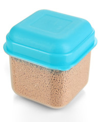 Dry yeast in container isolated on white