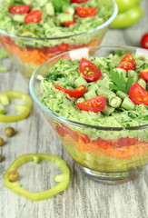 Tasty salad with fresh vegetables on wooden table
